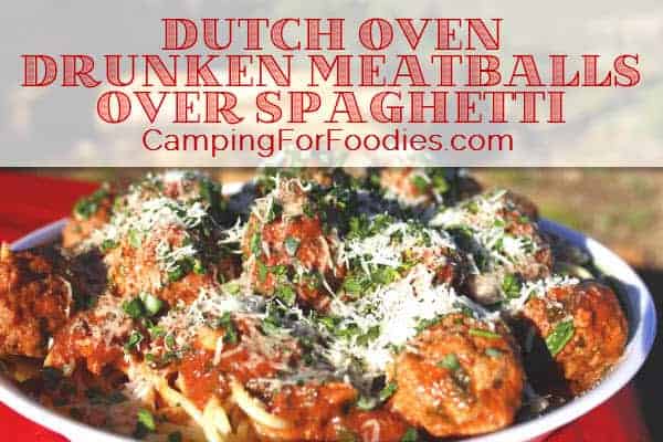 Dutch Oven Drunken Meatballs Over Spaghetti by CampingForFoodies features a big bowl of pasta topped with meatballs in a red wine and tomato sauce, ready to be served famiily-style at the campsite with text over the image that reads Dutch Oven Drunken Meatballs Over Spaghetti.