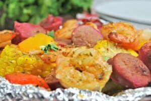 Cajun Shrimp Boil Foil Packet is a foil packet filled with shrimp, cajun spices, sausage and corn that has been cooked and is ready to eat.