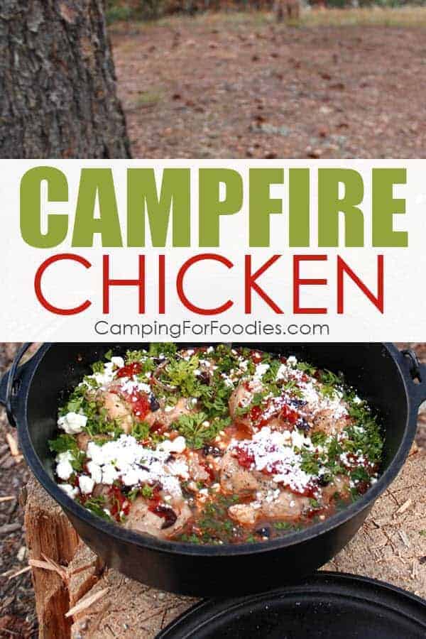 This Lemon Feta Campfire Chicken Dutch Oven Camping Recipe by CampingForFoodies is sitting on a tree stump at a dispersed campsite in the mountains. The white feta cheese is sprinkled on top of the chicken with red tomatoes, bright green parsley and salty kalamata olives.