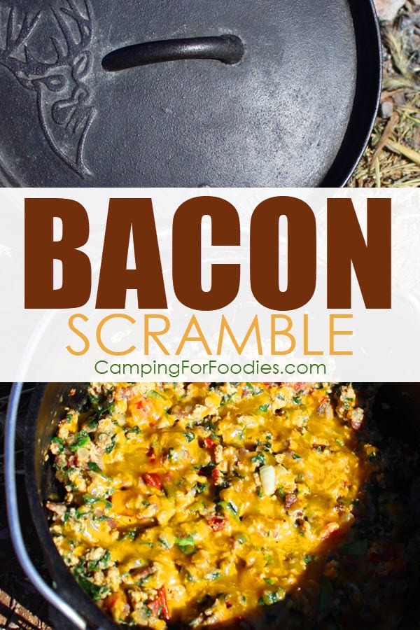 Dutch Oven Bacon Scramble by CampingForFoodies features a cast iron camp Dutch oven filled with a cooked breakfast ready to be served at the campsite which includes bacon, eggs, onions, spinach, tomatoes and melted cheddar cheese with text over the image that reads bacon scramble.