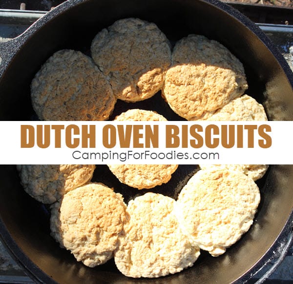 Camp Cooking Tip Dutch Oven Biscuits by CampingForFoodies features 9 freshly baked golden brown biscuits that are nestled in a black cast iron Dutch oven at the campsite ready to be served with text over image that reads Dutch oven biscuits.