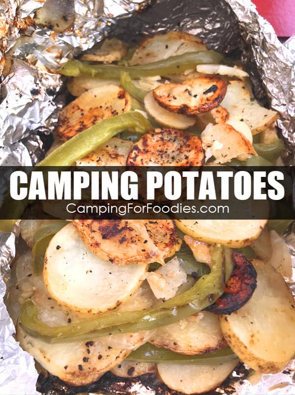 Camping Potatoes by CampingForFoodies features a camping side dish that is sitting in an opened foil packet ready to be served that includes sliced potatoes and green bell peppers seasoned with garlic and butter with text over the image that reads camping potatoes.