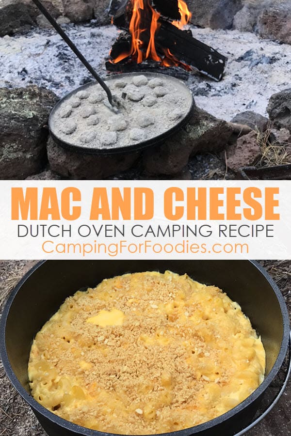 Mac And Cheese Dutch Oven Camping Recipe by CampingForFoodies features a cast iron camp Dutch oven pot filled with creamy macaroni and cheese topped with a golden brown crumb topping ready to be served at the campsite with a campfire roaring in the background with text over the image that reads Mac And Cheese Dutch Oven Camping Recipe.