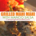 Grilled Mahi Mahi Recipe With Mango Salsa by CampingForFoodies features a marinated and grilled piece of Mahi Mahi topped with fresh mango salsa made from mangos, red onion, red bell pepper and cilantro with text over the image that reads grilled mahi mahi with mango salsa.