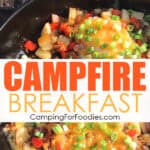 Campfire Breakfast by CampingForFoodies features a black cast iron skillet on a campfire cooking grate filled with a cowboy skillet breakfast including sausage, potatoes, onions, and eggs cooked two ways, scrambled and sunny side up and topped with melted cheddar cheese and sliced green onions. English muffins are alongside the skillet as they are being toasted over the campfire with text over the image that reads campfire breakfast.