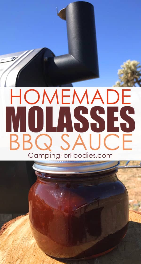 Old Fashioned Homemade Molasses BBQ Sauce by CampingForFoodies features a mason jar filled with barbeque sauce sitting on a wood log stump in front of a portable smoker at a desert campsite with a cactus in the background under a bright blue sky with text over the image that reads homemade molasses BBQ sauce.