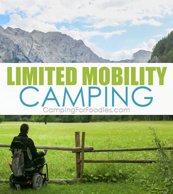 Limited Mobility Camping by CampingForFoodies features a man in a wheelchair sitting alongside a wooden rail fence in a green field in a forest looking at beautiful mountains in the background with text over the image that reads Limited Mobility Camping.