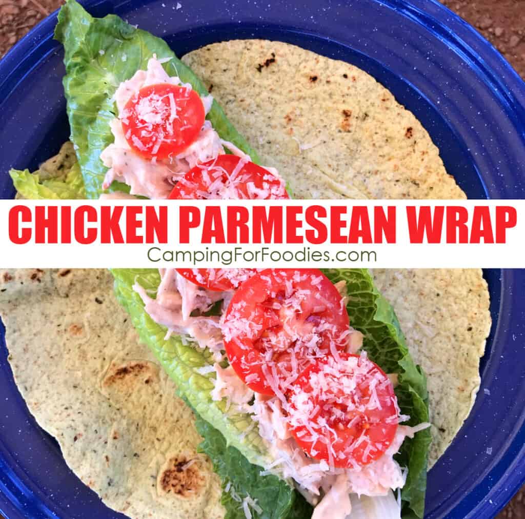 Chicken Parmesan Wrap Recipe by CampingForFoodies features a blue camping plate topped with a green spinach tortilla, leaf lettuce, shredded chicken tossed in a ranch salad dressing then finished off with sliced tomatoes and freshly grated Parmesan cheese with text over the image that reads Chicken Parmesan Wrap.